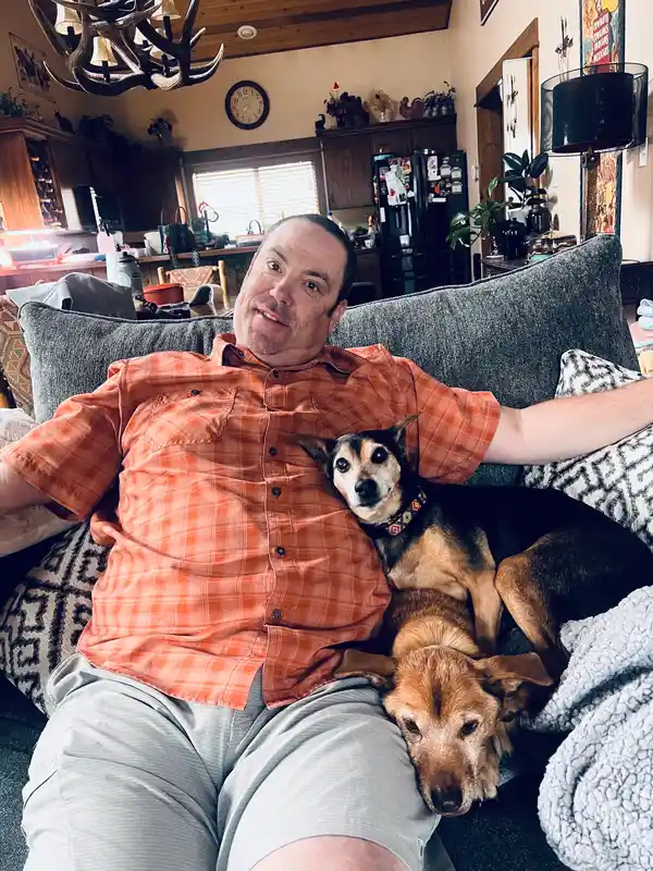 Travis with two dogs